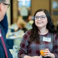 Cassidy Grooms talking with someone at Scholarship Dinner 2019